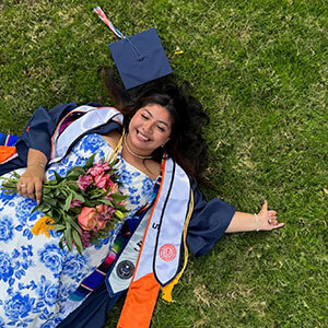 Ashley Escobar in graduation cap and gown