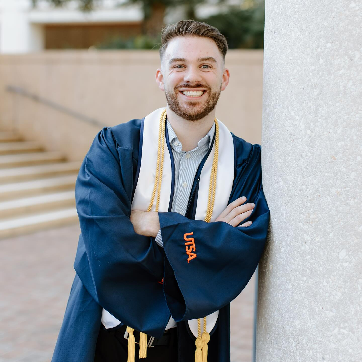 Rhett Whiting in the Sombrilla wearing graduation regalia.