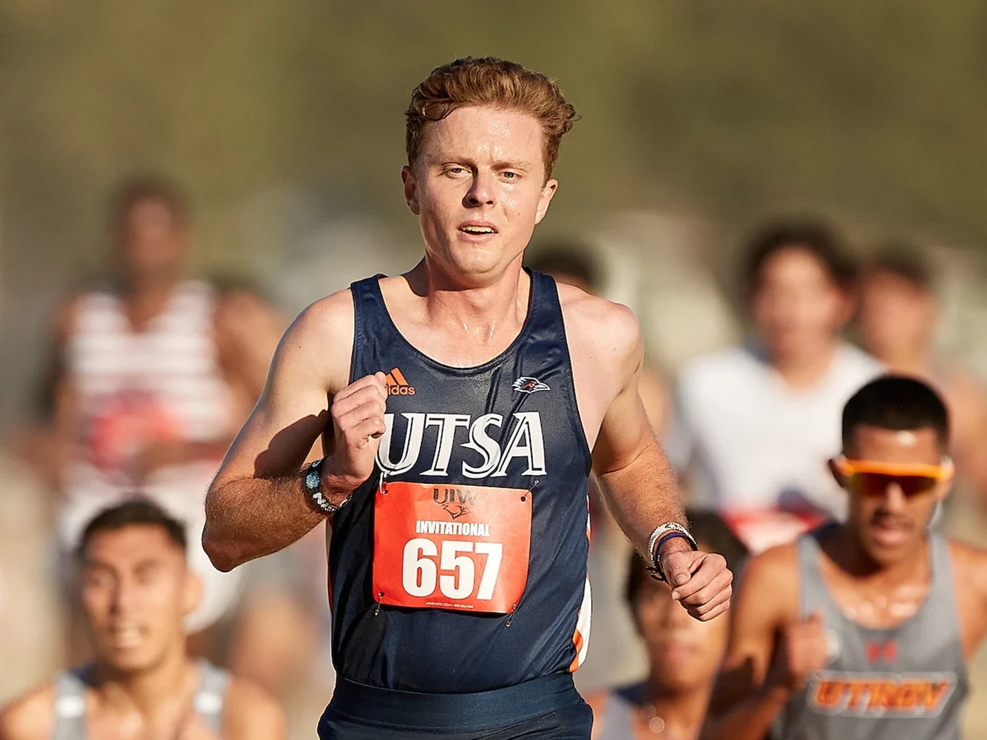 Harrison Wade representing UTSA in a cross country race.