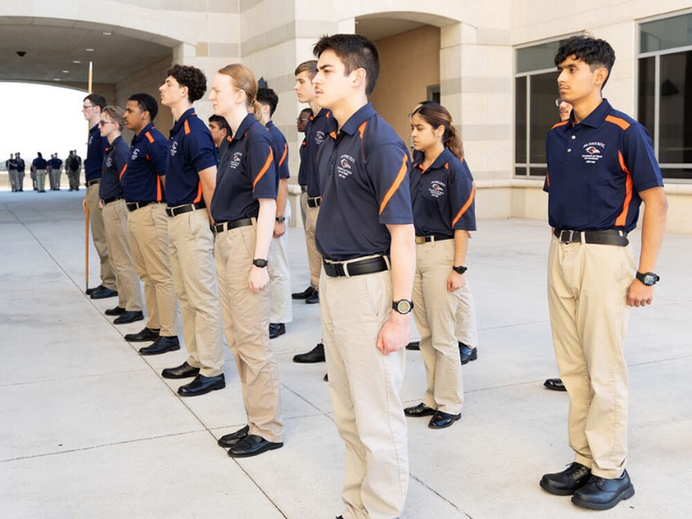 UTSA AFROTC students standing at attention on campus.