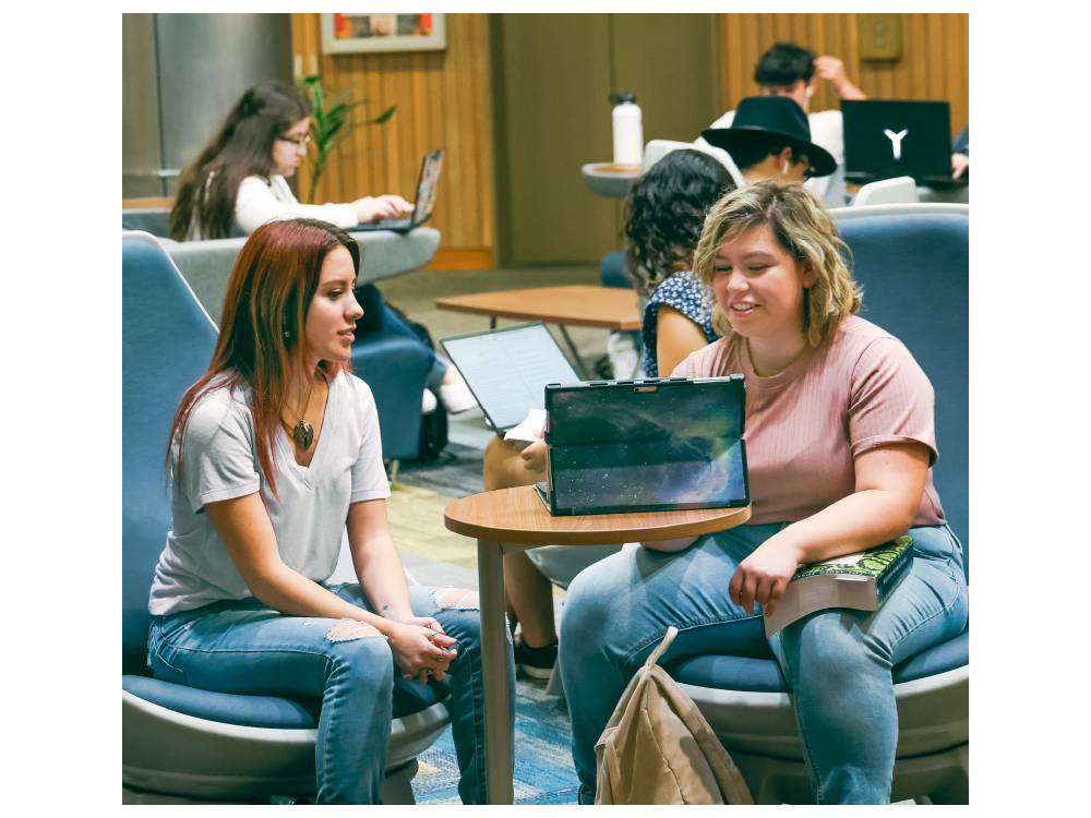Amanda Salas with a peer at the John Peace Library.