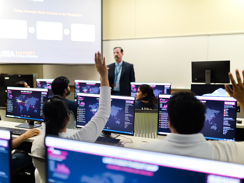applied cyber analytics professor with students in utsa classroom