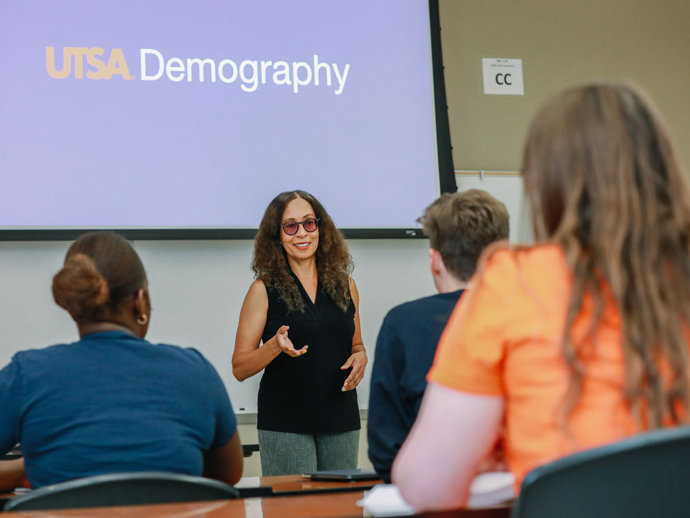 UTSA demography professor teaching in classroom