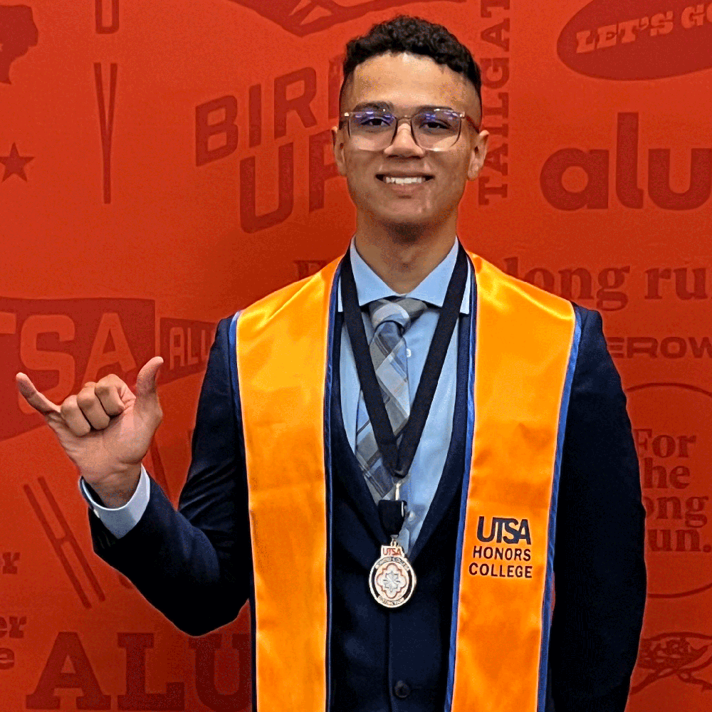 Dalen Ricks wearing Honors College graduation stole.