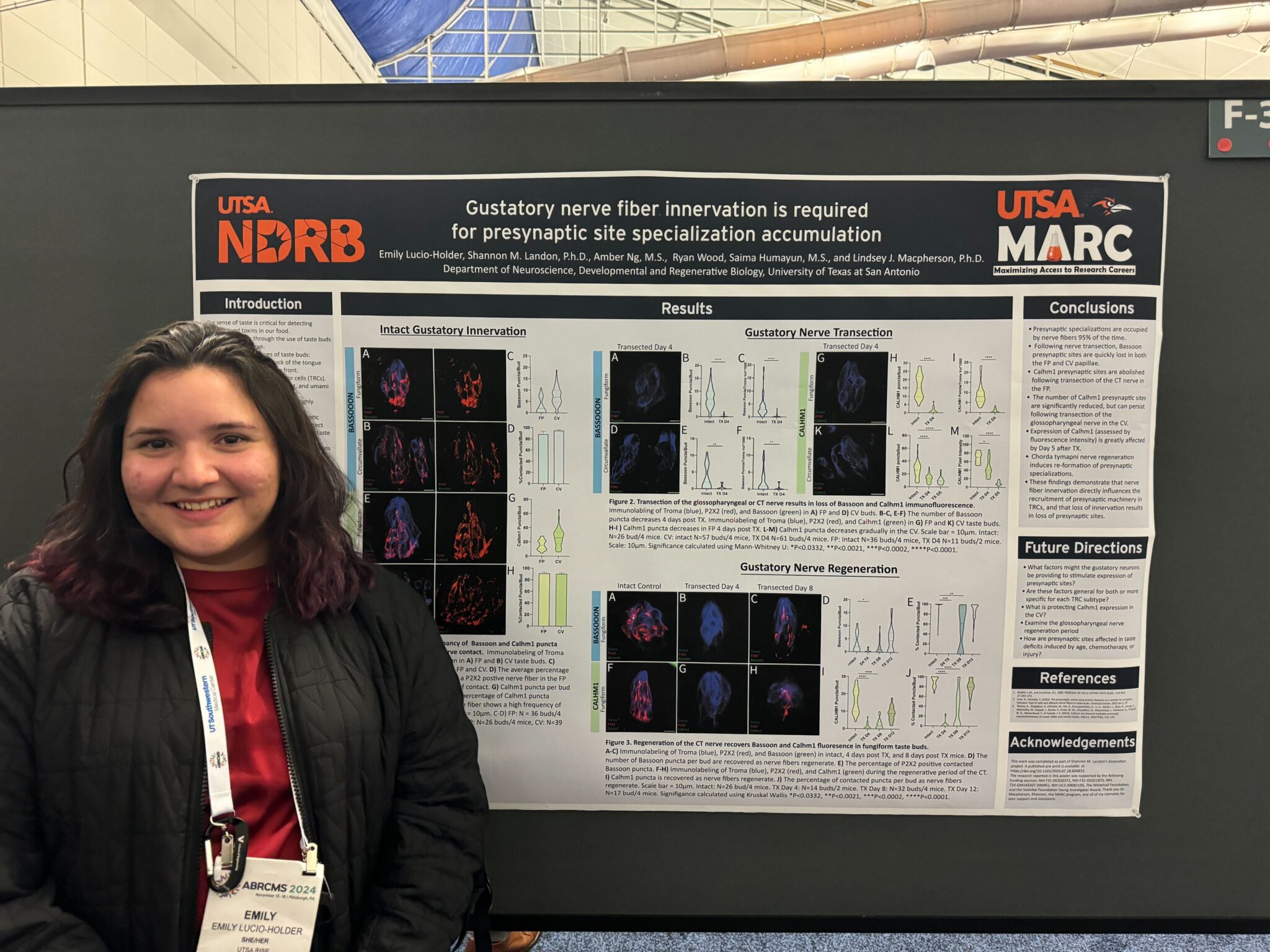Emily Holder presenting with her research presentation poster at Annual Biomedical Research Conference for Minoritized Students (ABRCMS).