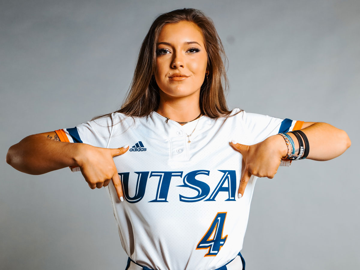 Lindsey Davis posing in her UTSA softball jersey.