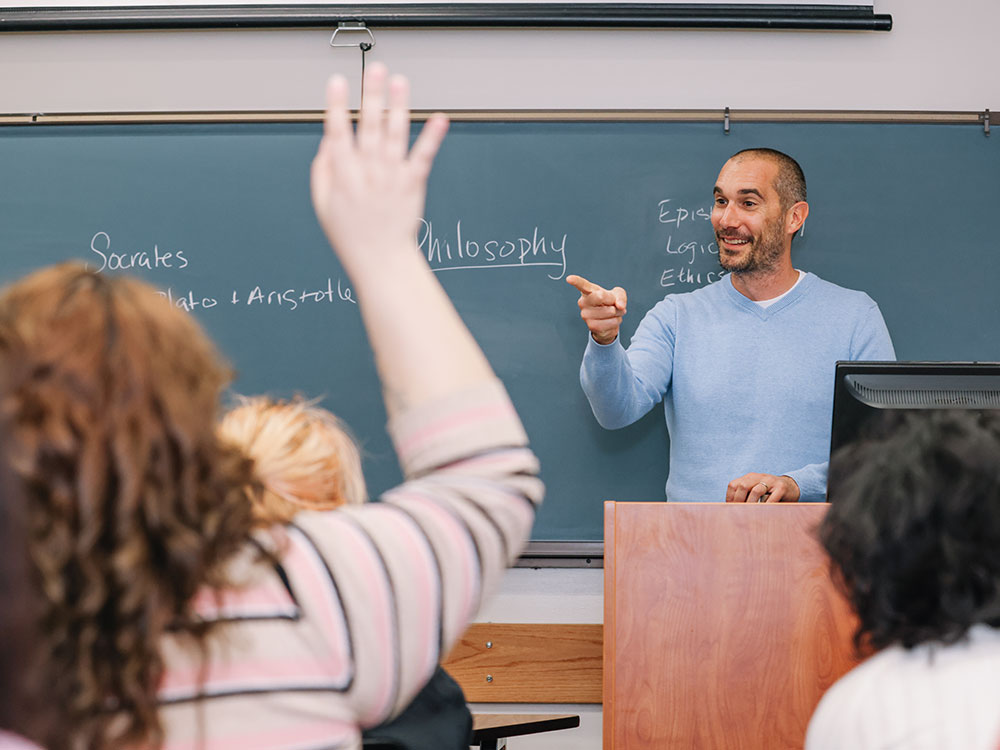 philosophy professor teaches in a classroom