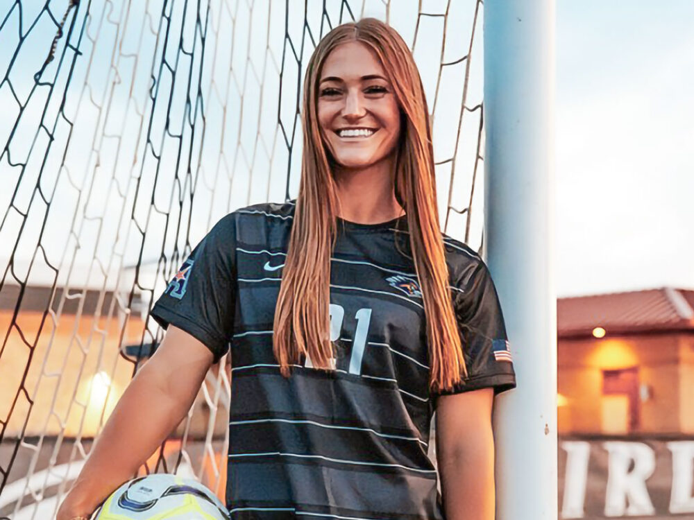 Rylee Miller posed in front of soccer goal.