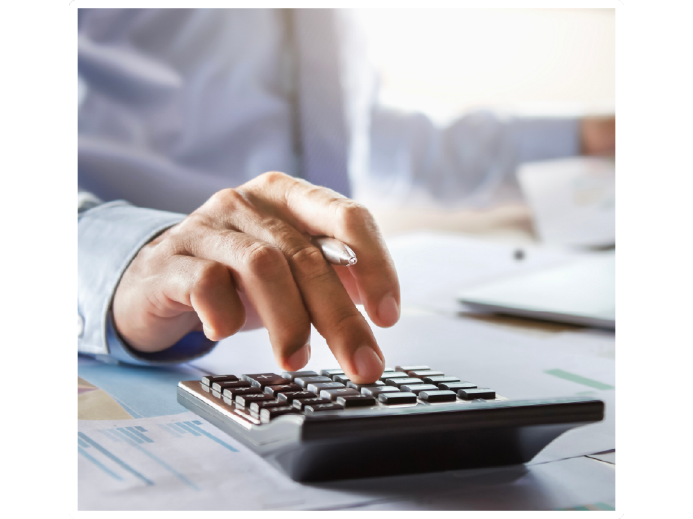 Person typing into a calculator