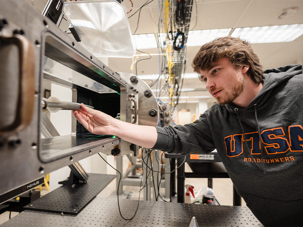 Student researching in hypersonics lab wind tunnel in mechanical engineering at The University of Texas at San Antonio