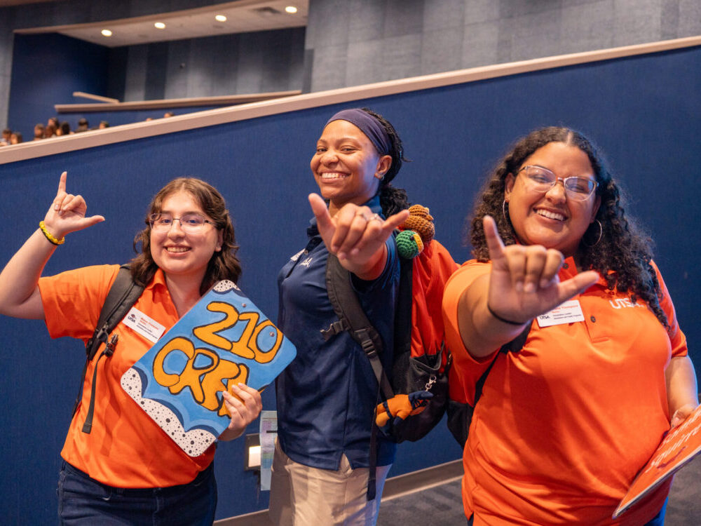 Alanna Hile (center) with two fellow Orientation Leaders