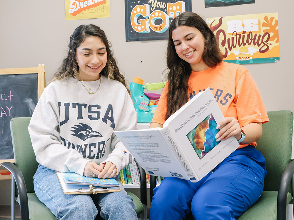 Students working together in applied behavior analysis program at UTSA
