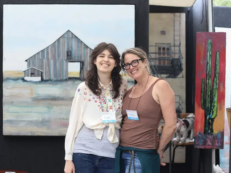Arwen Addison with her mother at art show.