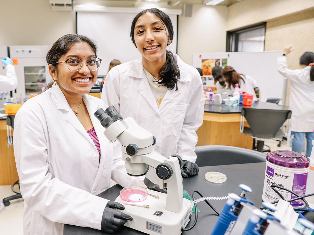 two utsa students working in biotechnology lab