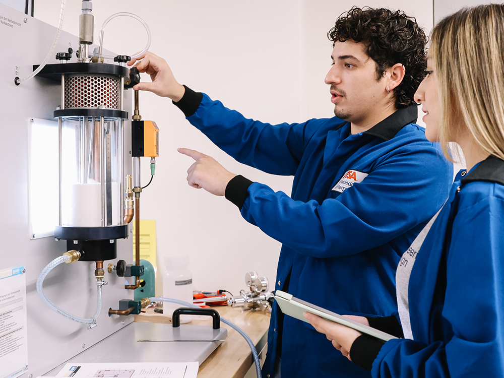 Two students conducting research in the Chemical Engineering Lab.
