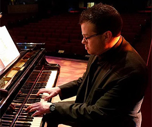 Chris Villanueva, School of Music professor at The University of Texas at San Antonio, performs on the piano