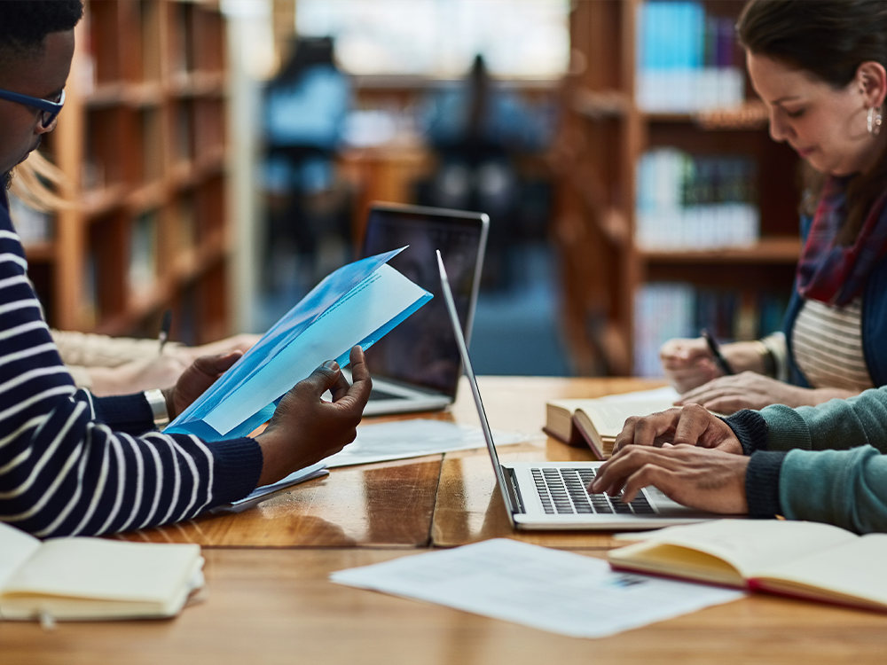 Doctoral student group studying.