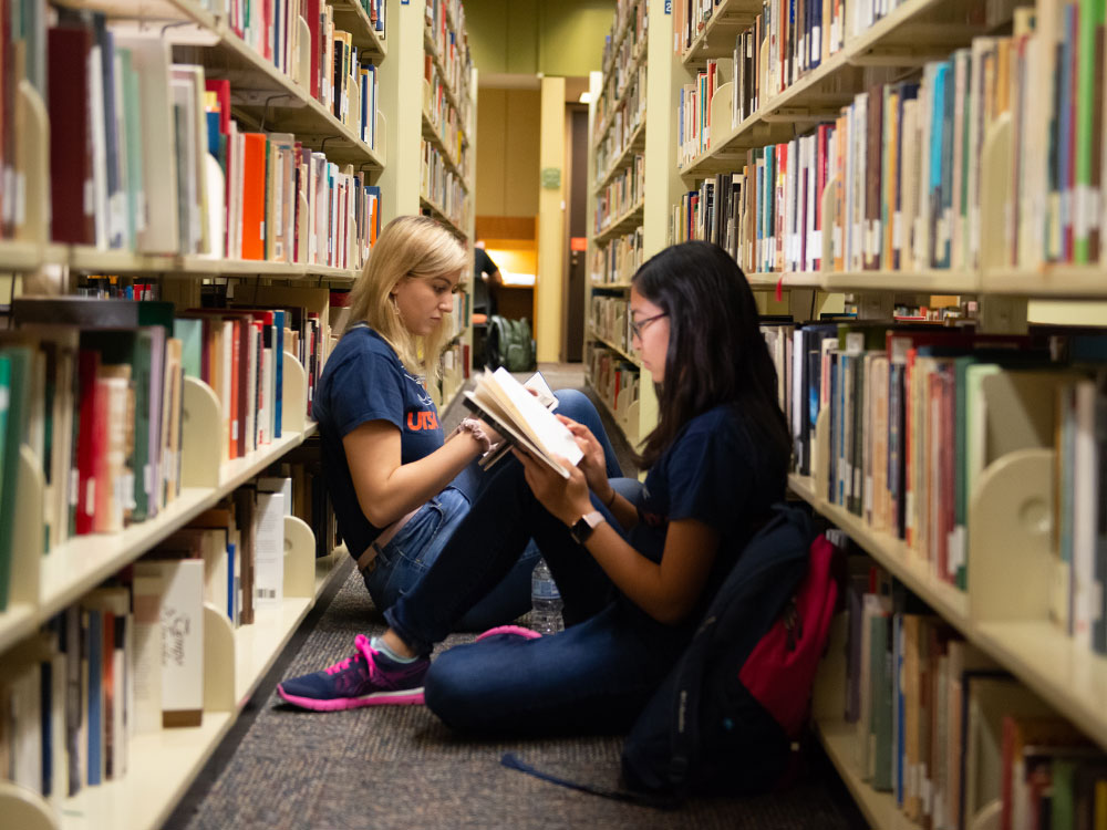 student reading in library