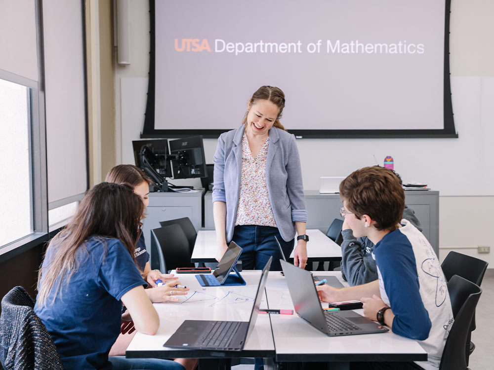 mathematics professor teaching students in classroom at utsa
