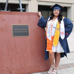Mia Mireles posed by the rowdy statue