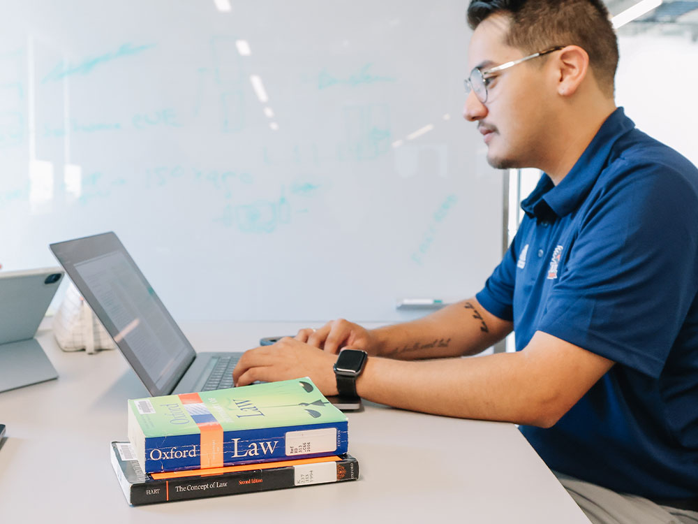 Student working on their laptop.