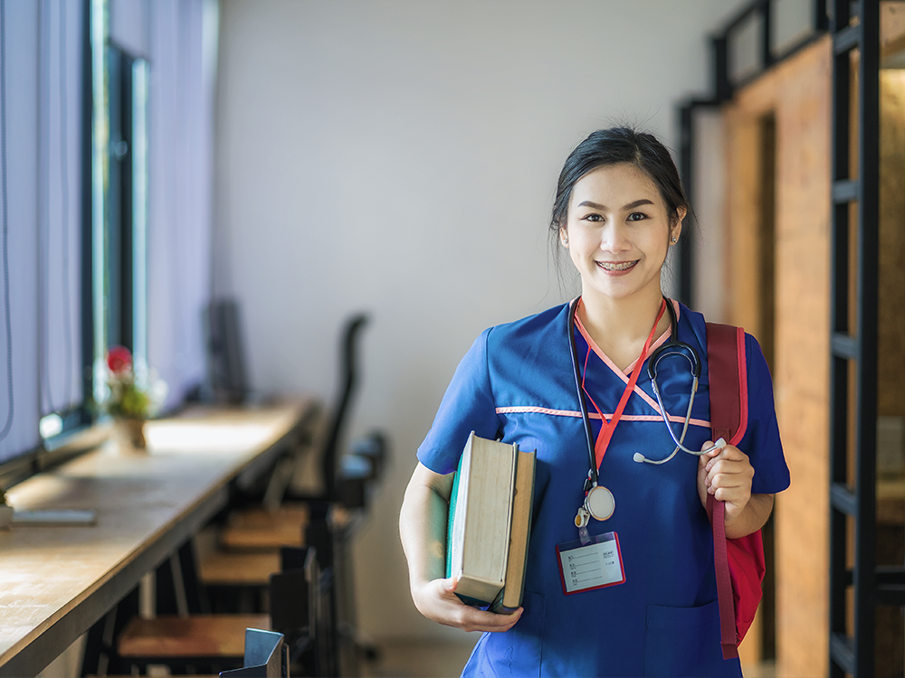 pre-nursing student with textbooks