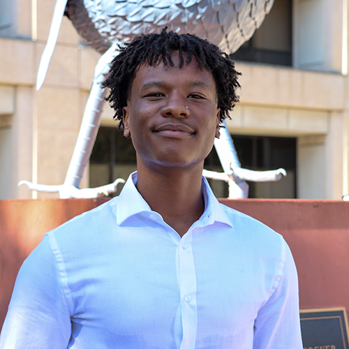 Fred Thompson in front of Rowdy statue.
