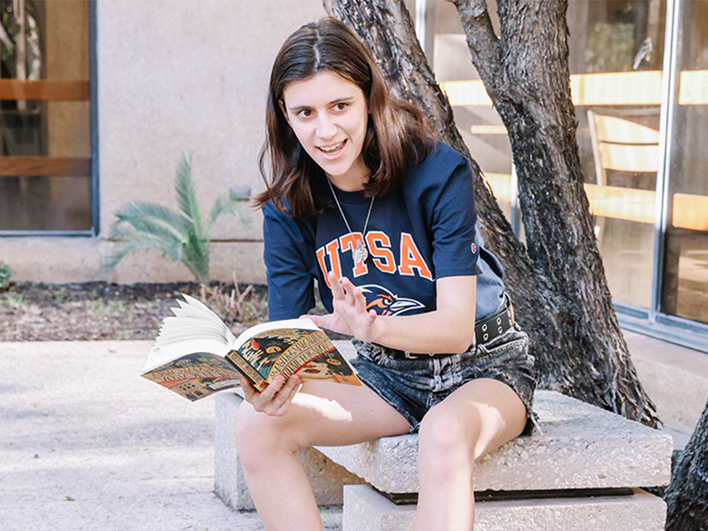 UTSA English student reads on campus